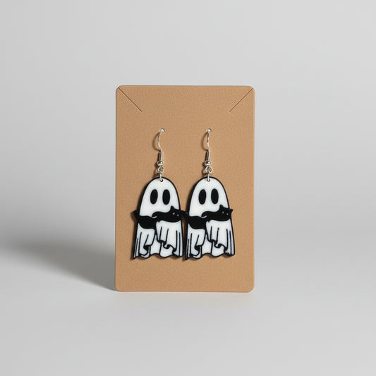 Ghost-shaped earrings with mustaches on a brown card with floral background