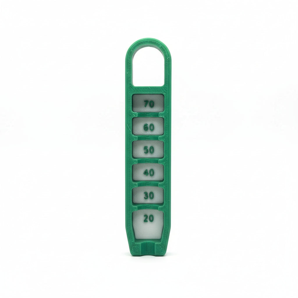 Green dice holder with numbered dice on a textured silver background