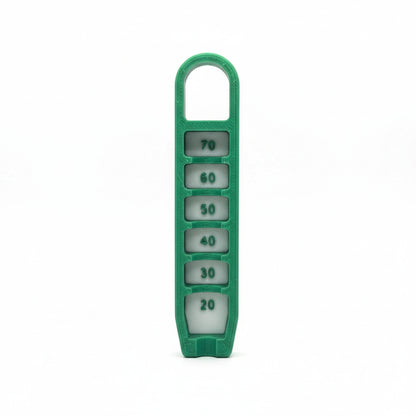 Green dice holder with numbered dice on a textured silver background
