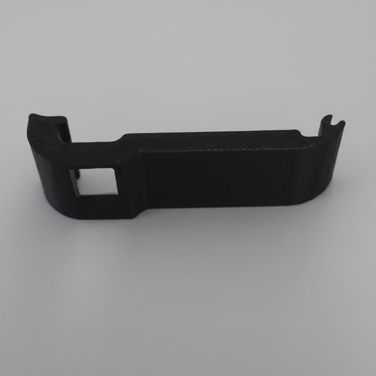 Black plastic car dashboard trim on a gray background